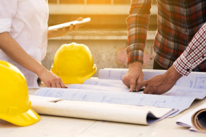 three construction engineers working outdoors in construction si