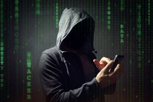 Computer hacker with mobile phone