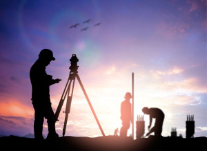 silhouette survey engineer working  in a building site over Blur