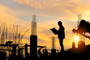 Silhouette of Engineer and workers checking project at building